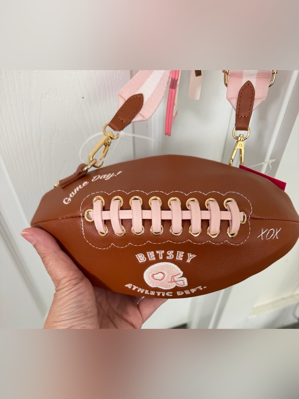 Brown Football-Shaped Crossbody Bag with Pink Striped Strap - Betsey Johnson - Picture 2 of 5